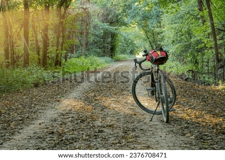 gravel touring bike on Katy Trail near McKttrick, Missouri, in fall sunset scenery Royalty-Free Stock Photo #2376708471