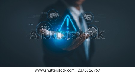 businessman shows warning about using artificial intelligence (Ai) technology to access malicious software or online threats, concept of Internet cyber security warning or technology scam alert. Royalty-Free Stock Photo #2376716967