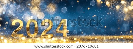 2024 New Year Celebration - Golden Number And Fireworks At Blue Eve Night In Abstract Defocused Lights