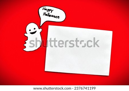 ghost next to empty card on redbackground 