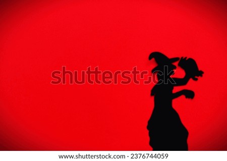 witch on the red background 