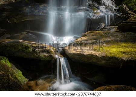 Silky waterfall cascading down rocks