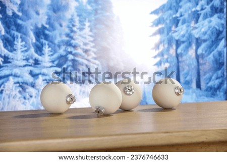 Board of free space for your decoration. Chrismtas balls. Home interior with fireplace and christmas tree. Blurred lights with bokey. Empty mockup photo. 