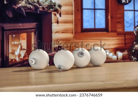 Board of free space for your decoration. Chrismtas balls. Home interior with fireplace and christmas tree. Blurred lights with bokey. Empty mockup photo. 