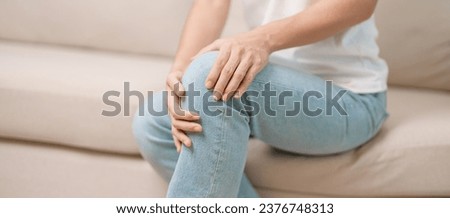 woman having knee ache and muscle pain due to Runners Knee or Patellofemoral Pain Syndrome, osteoarthritis, arthritis, rheumatism and Patellar Tendinitis. medical concept Royalty-Free Stock Photo #2376748313