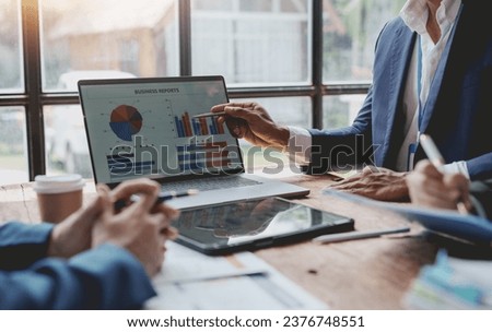 Business people, teamwork and meeting for strategy, planning or corporate brainstorming discussion at office. Business people meeting explaining the financial graph data and marketing plan. Royalty-Free Stock Photo #2376748551
