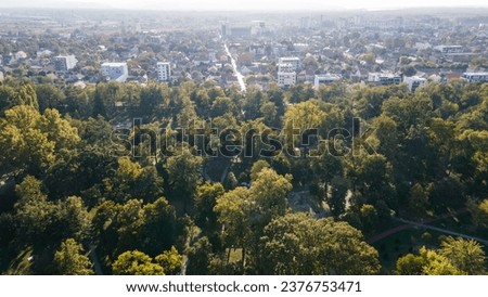 Sunset scene of modern apartments buildings and condominium in Pancevo, Serbia. Park is surrounded by buildings, apartment and houses. Aerial View of park in Pancevo, Serbia at sunrise