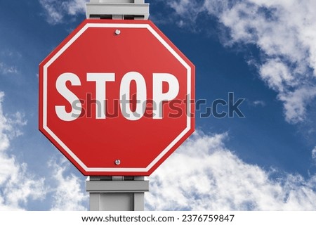 A red alarm stop sign at blue sky background
