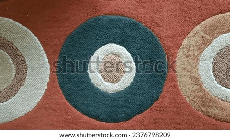 Multi-colored rubber and cotton carpet, round shape.