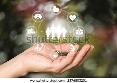 Patient Hands with Medical and Healthcare Icons. Royalty-Free Stock Photo #2376803251