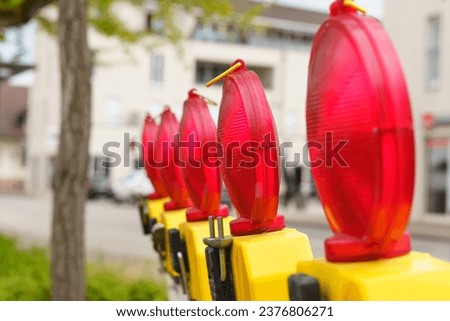 Red lanterns. Road repair. Warning signal at a construction site. Close-up.