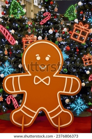 gingerbread man on a background of Christmas trees