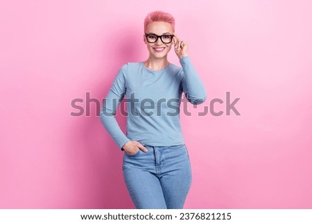 Photo of adorable stunning positive lady wear blue stylish outfit advertising eyewear sale discount isolated on pink color background
