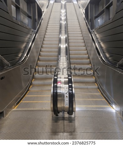 Moving escalator without people, city photo Royalty-Free Stock Photo #2376825775