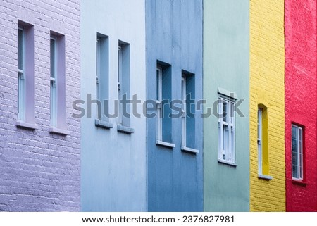 Tight image of multi-coloured terrace town houses windows - Chelsea, London, UK - Landscape