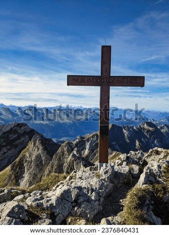 Panorama picture on the Silberplatten with summit cross in Appenzell. With a view of the Churfirsten in Toggenburg. High quality photo