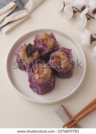 Purple sweet potato dim sum. It is a large range of small Cantonese dishes that are traditionally enjoyed in restaurants for brunch