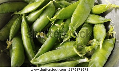 Green peas background. Vegetarian food concept. High quality stock photo.