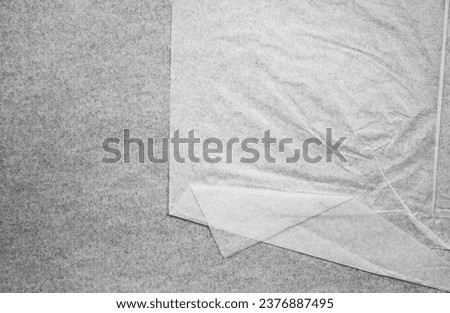 Old thin crumpled paper. White crumpled translucent paper, texture. Royalty-Free Stock Photo #2376887495