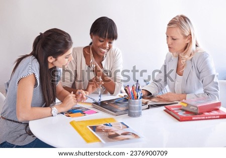Business women, teamwork and meeting of magazine, graphic design and project brainstorming or proposal. Group of people, designer and b2b manager with portfolio book, planning and advertising agency