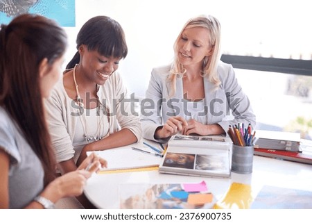 Business women, teamwork and meeting for magazine planning, collaboration or photograph and clients ideas. Designer group, manager and people with print, book catalog or portfolio at marketing agency