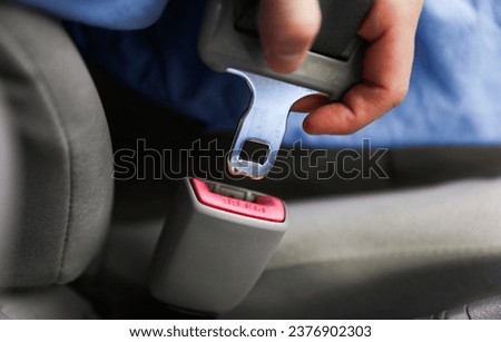 seat belt and buckle, symbolizing safety and accident prevention, a powerful image against drunk driving and promoting responsible habits Royalty-Free Stock Photo #2376902303