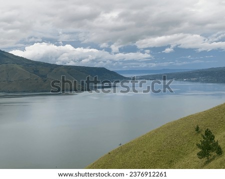 This is called Lake Toba at North Sumatera. Really amazing panorama and always thanx God. Come n Visit Indonesia. Royalty-Free Stock Photo #2376912261