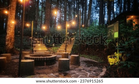 Campfire in the middle of tropical forest campsite