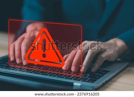 laptop shows a warning sign of system failure and a leak of software data. concept caution danger if a computer is attacked cyber error symbol, notification spam, risk of website