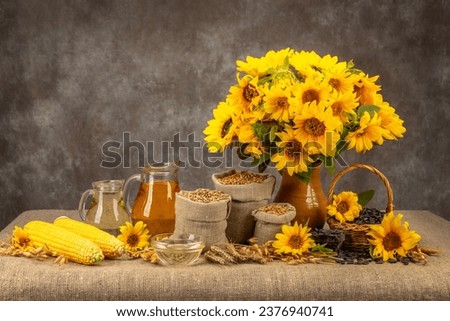 still life with sunflowers harvest. sunflower oil. seeds in a basket.