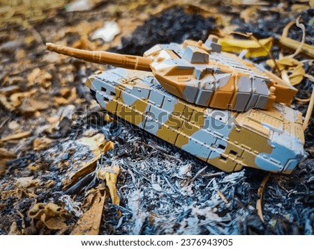 photo of a red military tank toy that looks like it is in war, can be used as a banner poster and wallpaper design