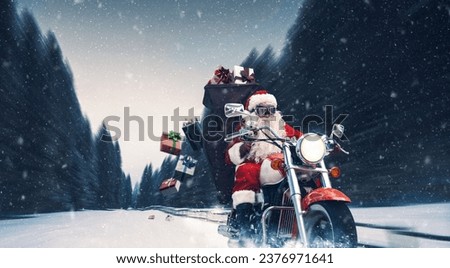Unconventional biker Santa Claus riding a fast motorbike and delivering Christmas gifts Royalty-Free Stock Photo #2376971641