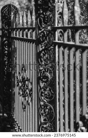 Isolated close up black and white high resolution rustic exterior metal fence-  USA