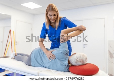 Sportsman Patient Undergoing Physical Therapy in Clinic to Recover from Surgery and Increase Mobility. Physiotherapist Works on Specific Muscle Groups or Joints to Rehabilitate from Injury.