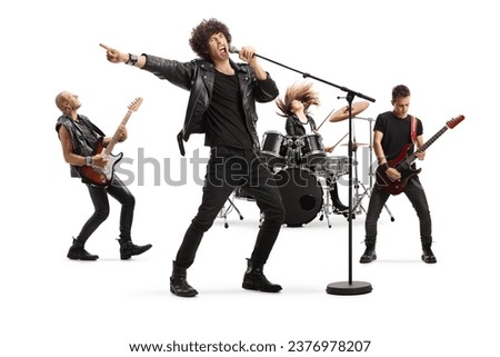 Rock music band performing isolated on white background Royalty-Free Stock Photo #2376978207