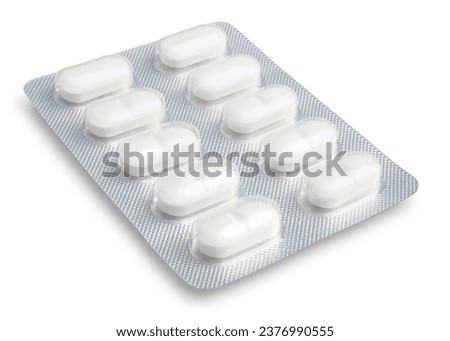 Clean, white, oval-shaped pills in an aluminum pill package with a clear plastic cover aluminum pill panel  perspective view photo stacked full depth field isolate on white background with clip path.