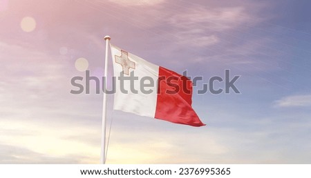 Malta national flag waving in beautiful sky. The flag waving with dynamic angle. Royalty-Free Stock Photo #2376995365