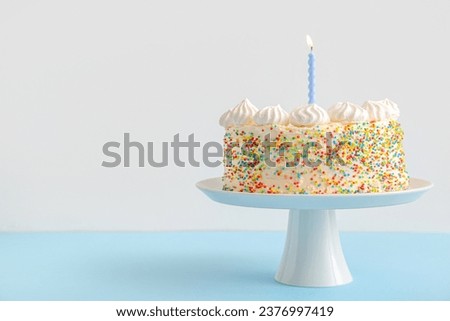 Stand with yummy Birthday cake on color background