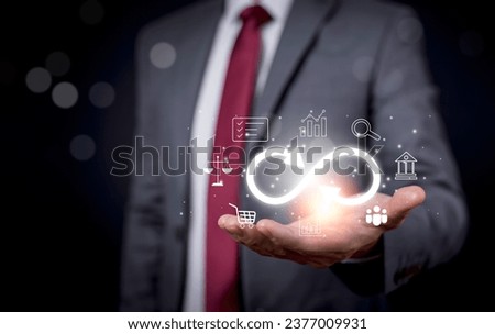 Business people hold Infinity symbol with technology global marketing online in business connection network economy strategy of investment, banking and financial data exchange for business growth.