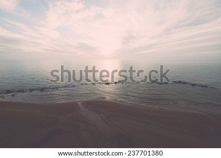 aerial view to the Shoreline of Baltic sea beach with rocks and sand dunes under clouds - retro, vintage style look