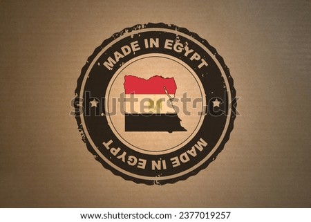 Brown paper with in its middle a retro style stamp Made in Egypt include the map and flag of Egypt.