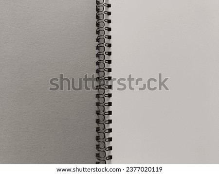 Open white spiral notebook, top view. Template, place for writing, for drawings, sketches. Royalty-Free Stock Photo #2377020119