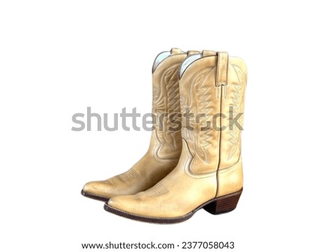 Genuine leather boots, cowboy style, white background.