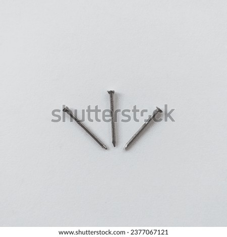 three nails. Similar to the Jesuit symbol. White background