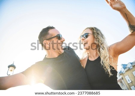 A Beautiful couple having fun outdoors on blue background