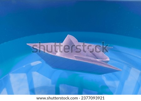 Paper boat in the middle of the wate