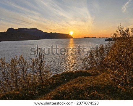 Midnight sun over the sea. Norway Lofoten islands. Royalty-Free Stock Photo #2377094523