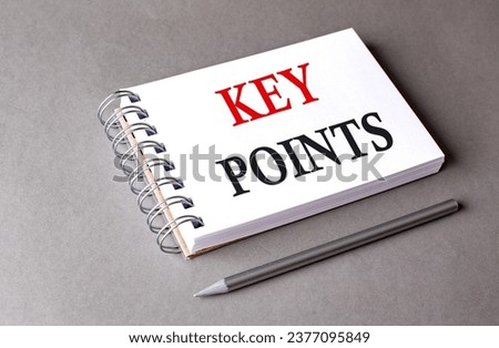 KEY POINTS word on a notebook on grey background