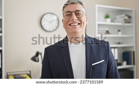 Young caucasian man business worker smiling confident at the office
