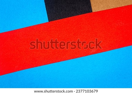 Multicolor background from a paper of different colors. Abstract colorful vibrant paper textures.